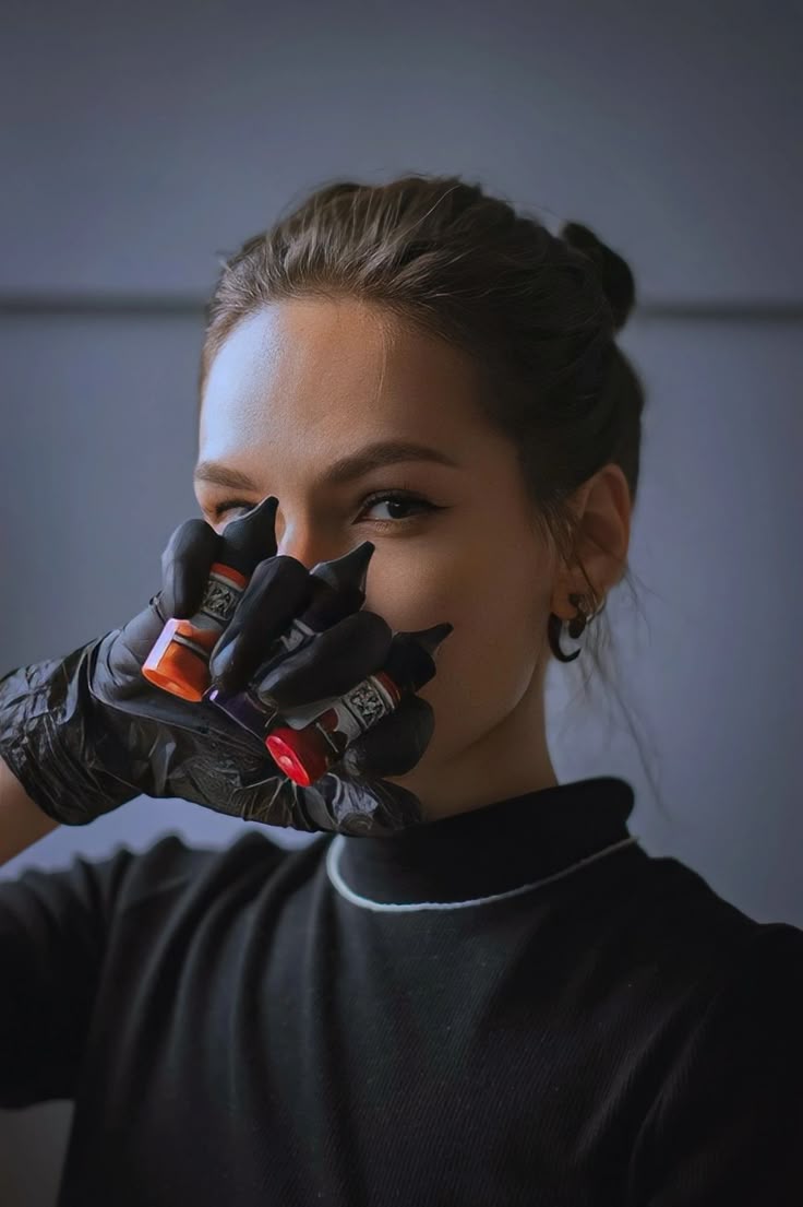 tattoo artist holding tattoo ink